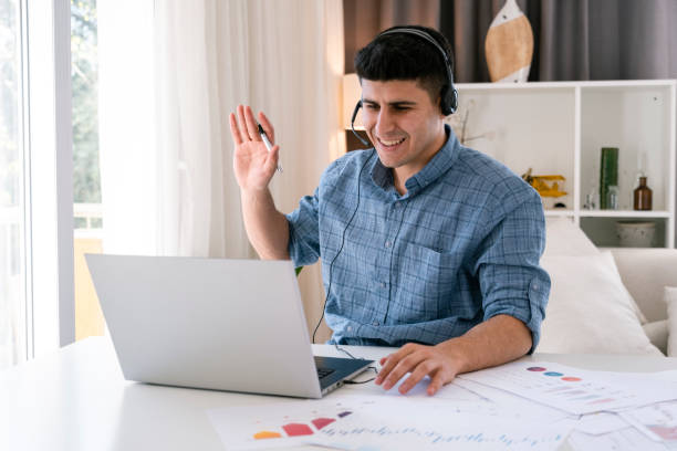istock happy young man talk on video call 1392008958