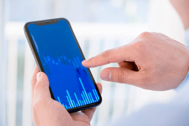 istock young man using a smartphone checks the cryptocurrency 1392008973