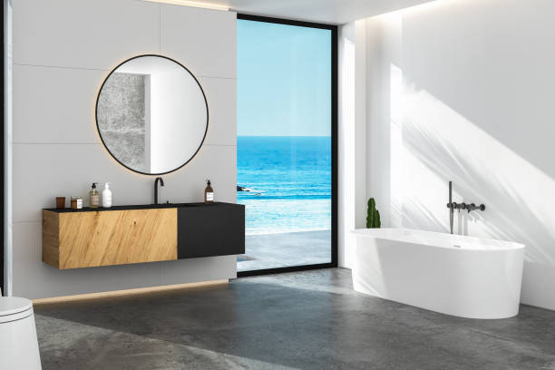 istock Interior of comfortable bathroom with white walls, 1392010541