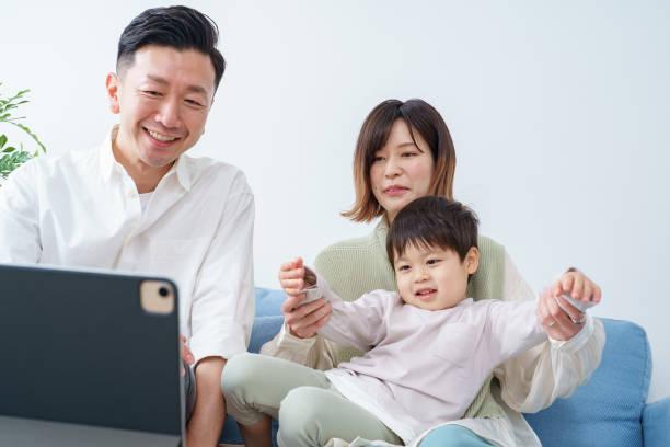 istock Family looking at the screen of a tablet PC 1392014632