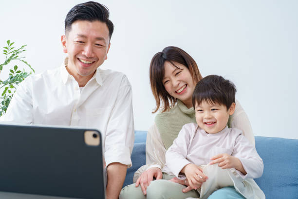 istock Family looking at the screen of a tablet PC 1392014652