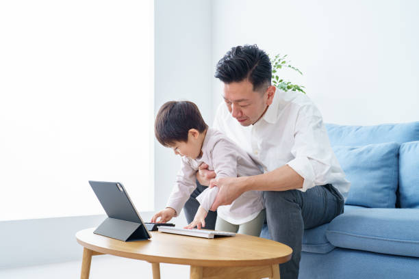 istock Parent and child hitting the keyboard 1392015702