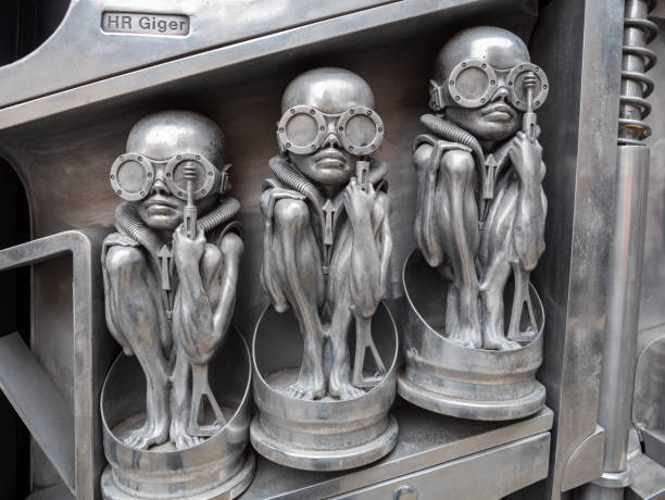 Gruyeres, Switzerland - November 23, 2021: Surrealist statue of alien machine man, creation of artist Giger