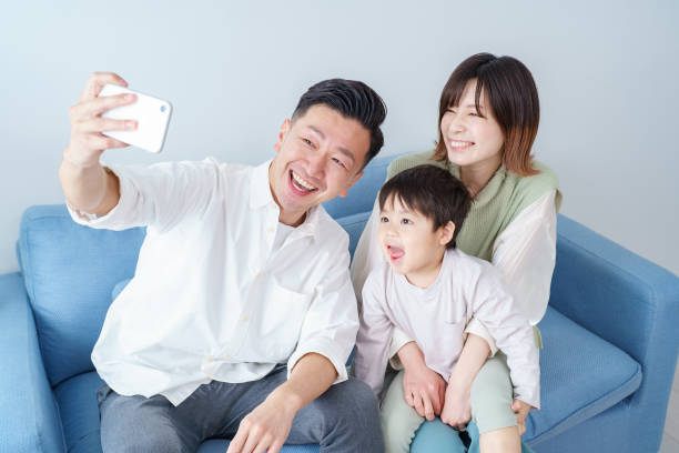 istock Parents and child taking selfie 1392016930