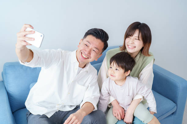 istock Parents and child taking selfie 1392016961