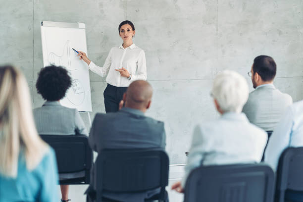 istock Young businesswoman speaking at a conference 1392016984