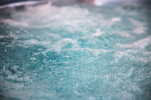 Close up of bubbling water texture in a hot tub