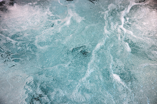 Close up of bubbling water texture in a hot tub