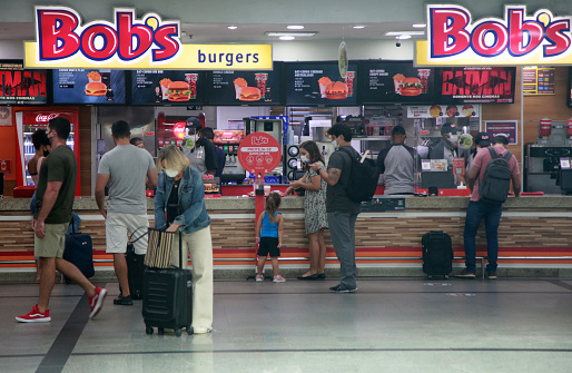 salvador, bahia, brazil - april 11, 2022: customers at a Bob's restaurant store in the food court at the airport in the city of Salvador.