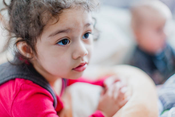 Toddler Girl Playing Inside at Home. Shot using natural light and authentic candid moments.