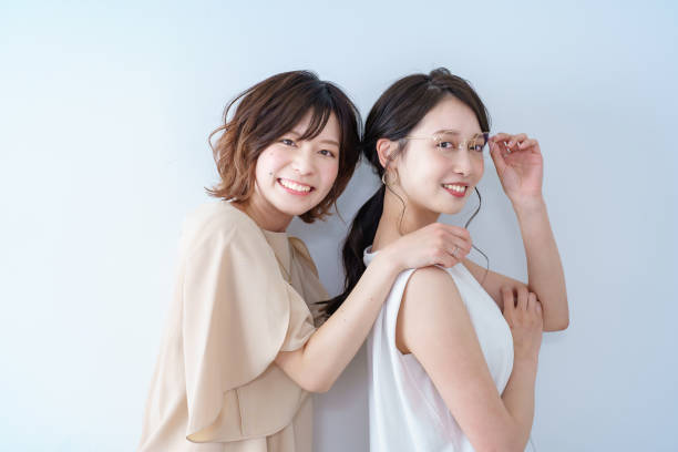 istock Two young women lined up 1392023602