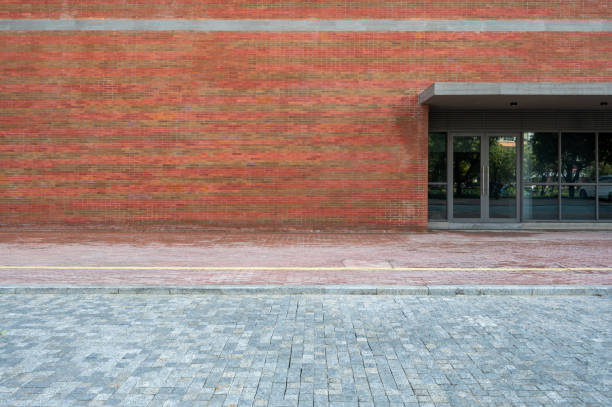 istock An empty road in front of the red building 1392025677