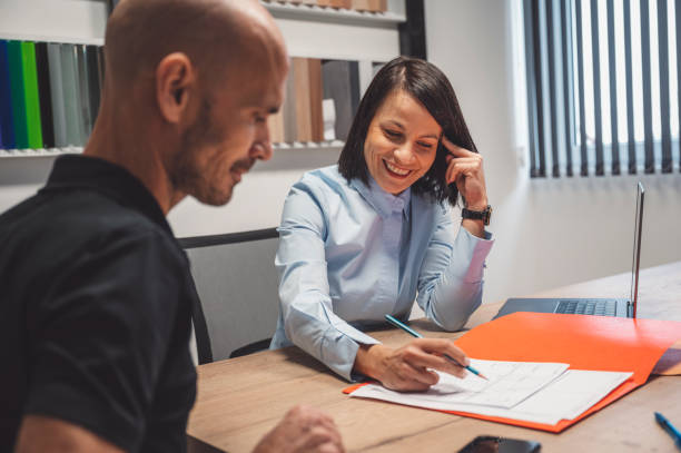 istock Divorce attorney brought papers for his client to sign 1392030771