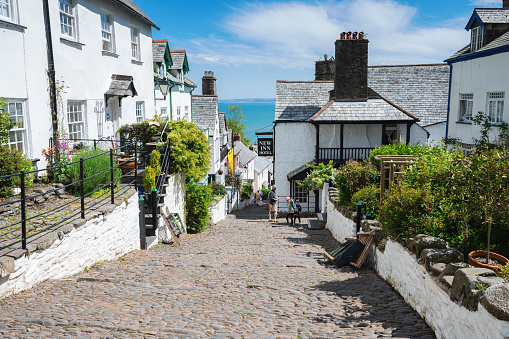 Clovelly, North Devon, United Kingdom - May 31, 2021. View of the old houses, pebble road to the beach, selective focus