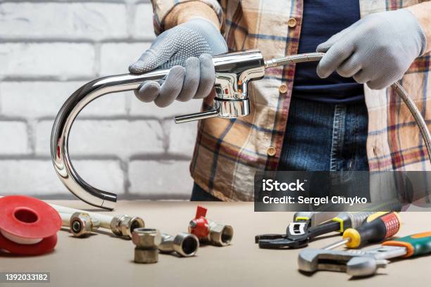 Man Plumber At Work Plumbing Repair Service Assemble And Install Concept Stock Photo - Download Image Now