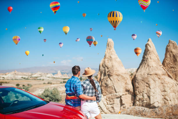 istock Happy man on summer vacation in famous place. Cave formations. 1392034413