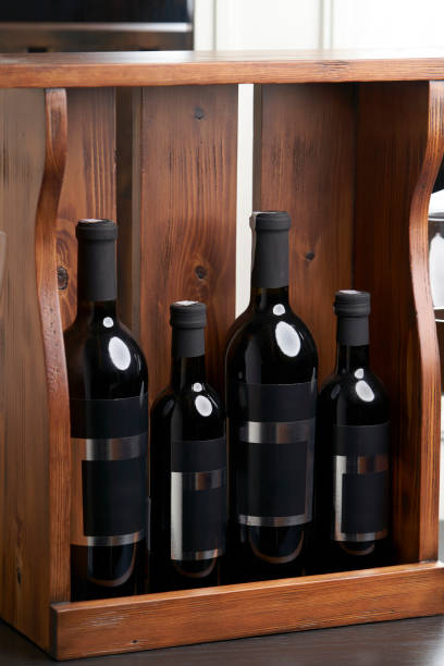 istock Wine bottles in wooden crate, close-up 1392039477