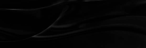 istock Black gray satin dark fabric texture luxurious shiny that is abstract silk cloth panorama background with patterns soft waves blur beautiful. 1392044153