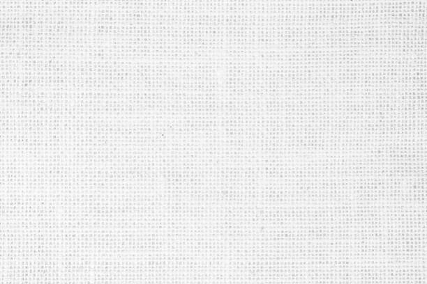 istock White fabric jute hessian sackcloth canvas woven gauze texture pattern in light white color blank. Natural linen and cotton cloth texture as clean background empty for decoration. 1392044936