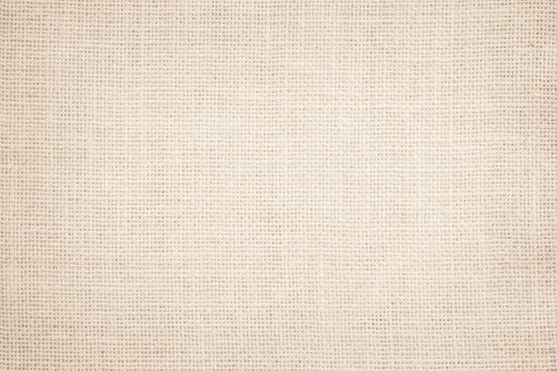 istock Jute hessian sackcloth burlap canvas woven texture background pattern in light beige cream brown color blank. Natural weaving fiber linen and cotton cloth texture as clean empty for decoration. 1392044940