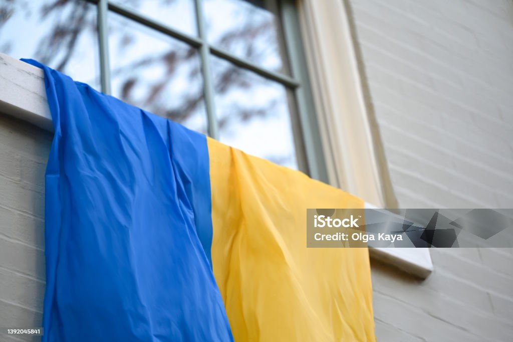 Ukrainian support Ukrainian flag hanging from the window USA Stock Photo