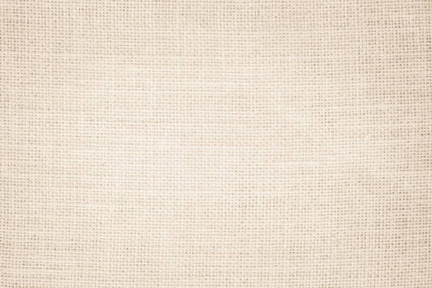 istock Jute hessian sackcloth burlap canvas woven texture background pattern in light beige cream brown color blank. Natural weaving fiber linen and cotton cloth texture as clean empty for decoration. 1392046687