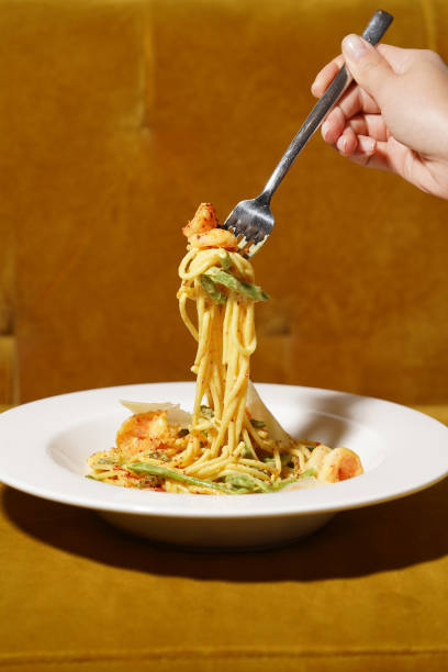 istock Spaghetti pasta with shrimp, parmesan cheese and green beans 1392047041