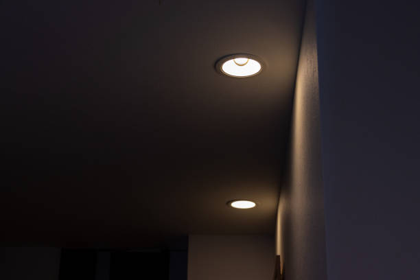 istock Ceiling downlights that illuminate the wall of the aisle 1392047882