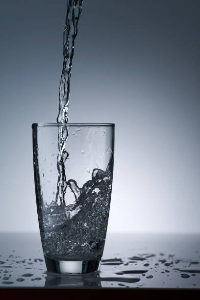 istock puring refreshment freshness drinking water on clean transperence glass in studio back light 1392050371