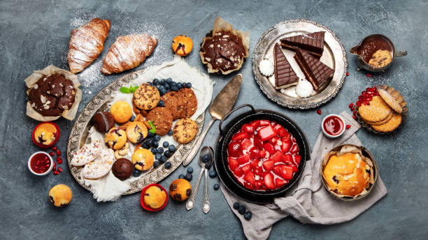 istock Dessert table with all kinds of cakes and snacks. 1392052914