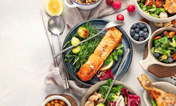 istock Healthy food assortment on light background. 1392054091