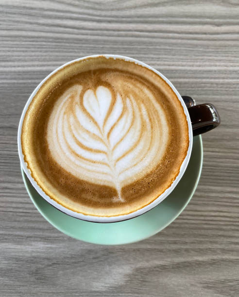 istock Appetising Hot Latte. Flower Latte Art 1392054876