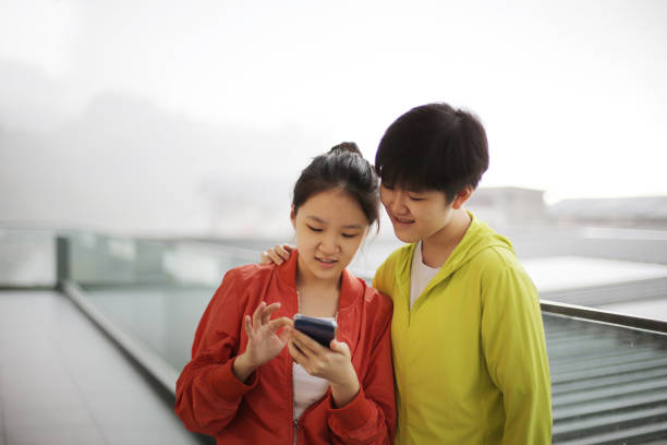istock Asian Teenage Sisters 1392057343