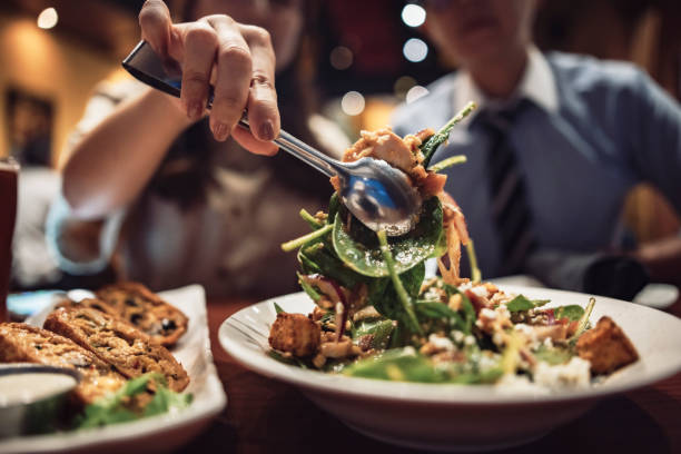 istock Two asian women eating together in restaurant 1392059497