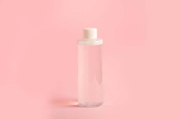 istock A bottle of micellar water stands on a pink background 1392060438