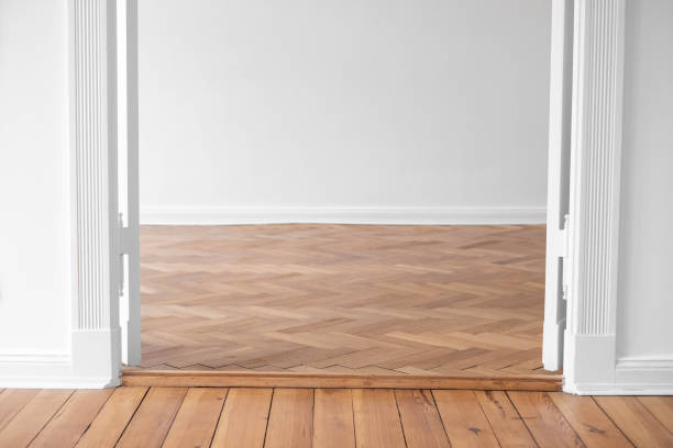 istock paruet floor in empty apartment room with open double wing door , 1392065423