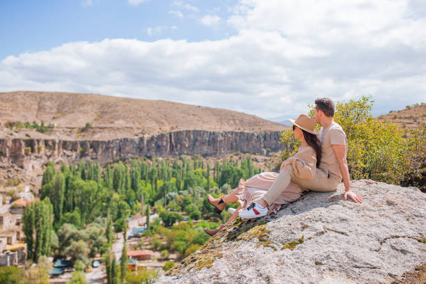 istock Happy couple on summer vacation in famous place. Cave formations. 1392065621