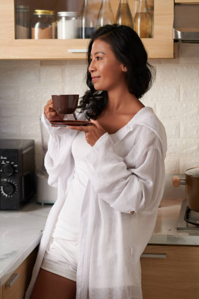 istock Woman Drinking Morning Coffee 1392072755