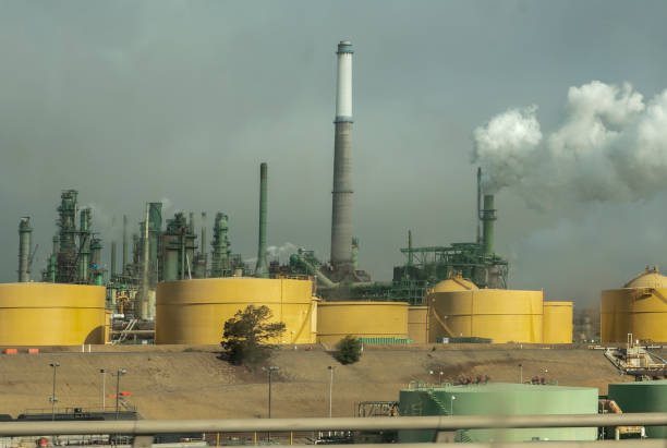 Valero oil refinery viewed from nearby highway on a foggy morning. Benicia, California, USA.