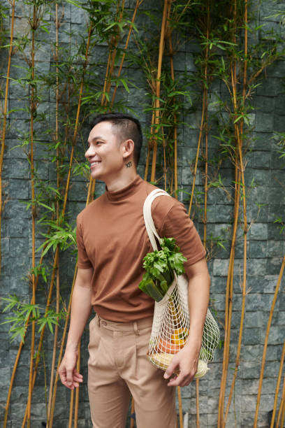 istock Young Man Shopping Local 1392075827