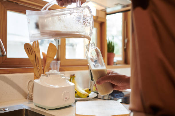 istock Man Filling Bottle with Shake 1392075874