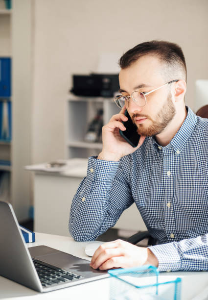 istock Businessman working on his laptop in an office 1392080935
