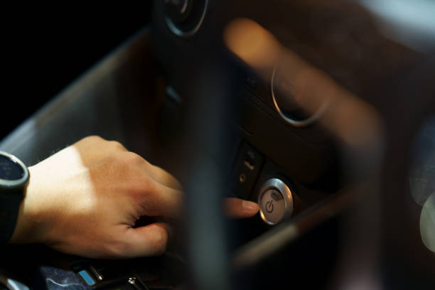 istock pushing power ignition button to start keyless ignition hybrid car engine 1392082459