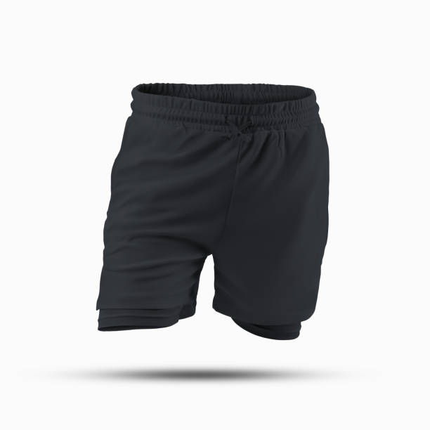 istock Mockup of black loose shorts with compression lining, elastic band, drawstring waist, 3D rendering, isolated on background, front view. 1392083079