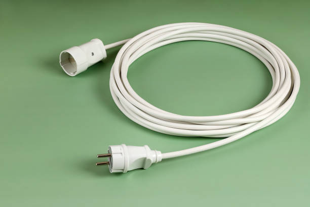 istock Long Wire Delivery Energy Extension Socket, Volt Energy Connecting Devices, On Green Background 1392084203