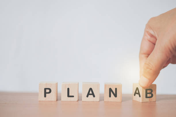 istock senior's hand turned cube and changing the word 'Plan A' to 'Plan B' with copy space for business strategy concept,  choosing or changing plan  in a person's life 1392084220