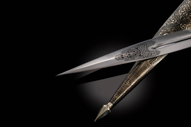 collectible silver dagger with scabbard on black