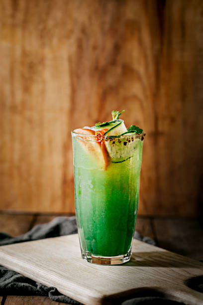 Green Summer Tropical Cocktail with tomatoes, cucumber, mint leaf and salt rim High Resolution Stock Photo stock photo