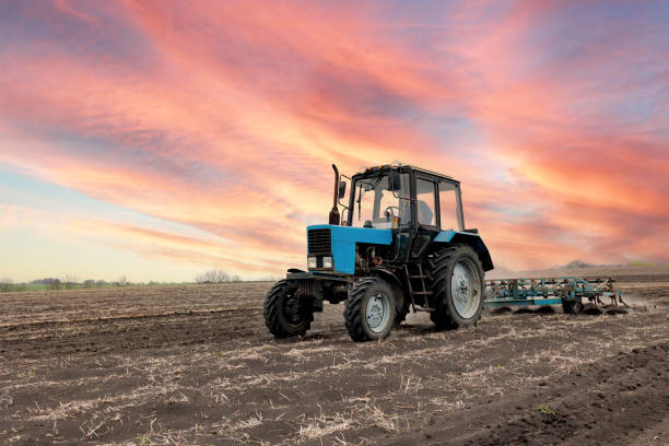 istock Farmer in tractor preparing farmland with seedbed 1392086849