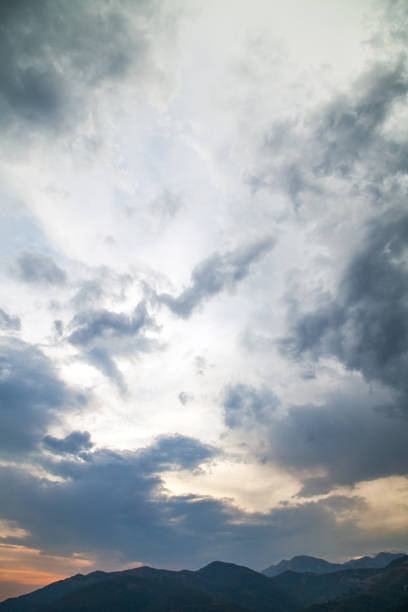 istock Dramatic sunset over the silhouette of mountain range 1392087115